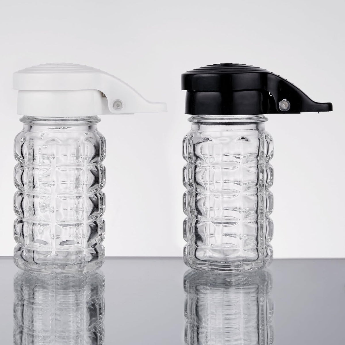 Moisture Proof Salt & Pepper Shakers - 1.5 Oz - Glass w/Black & White Lids Spring Loaded, No Clog, Set of 2